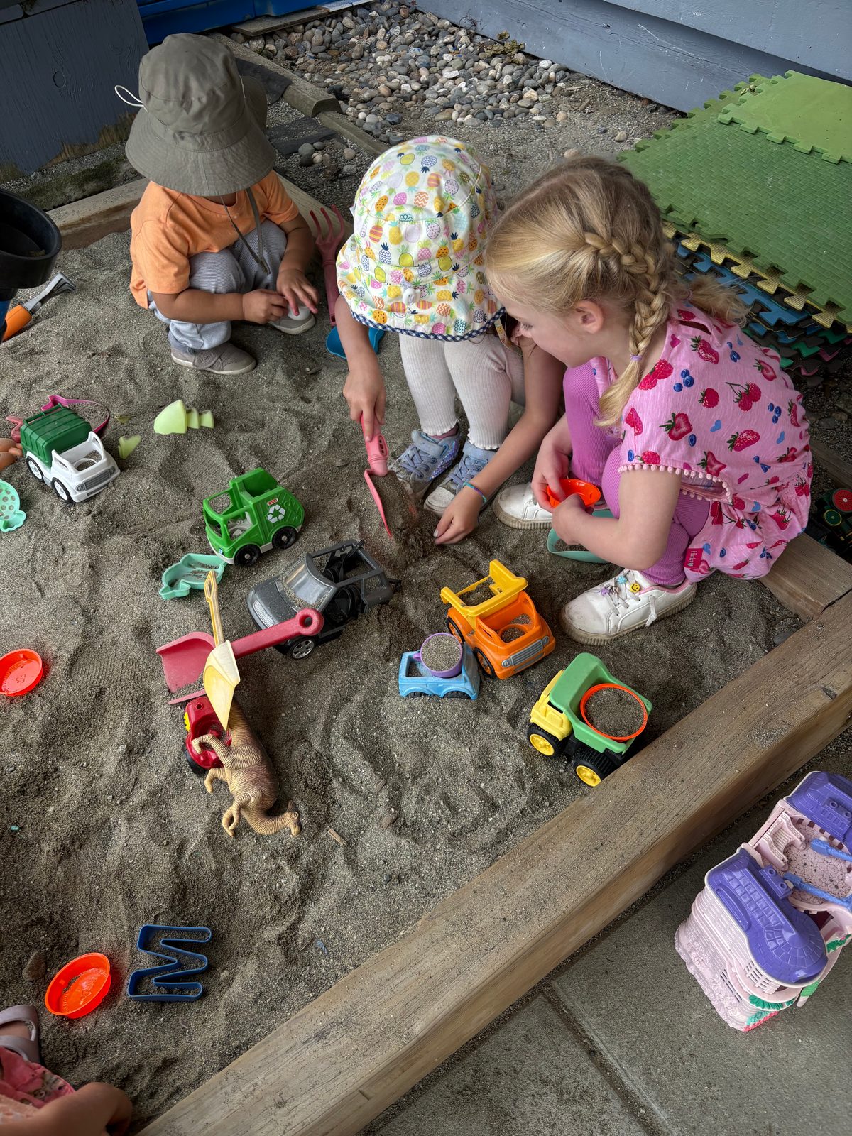 Children exploring the sandbox together