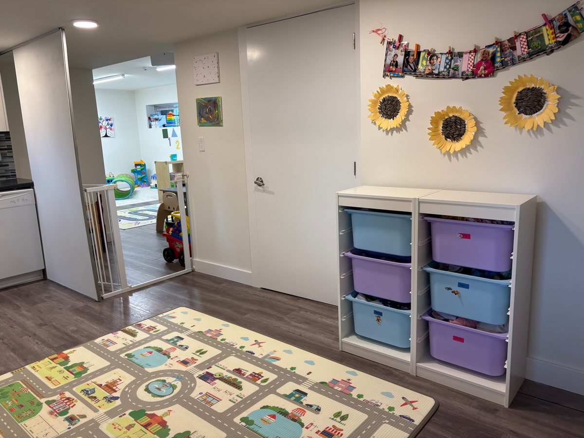 Playroom with toy storage and children's artwork